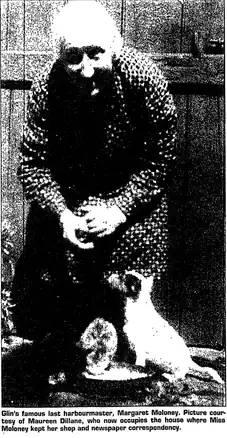 Very poor resolution photo of an older woman, hunched over. There small dog sitting beside her.