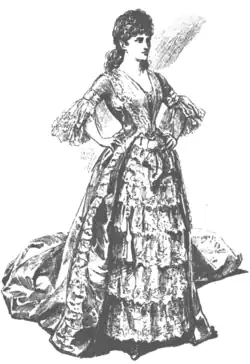 Young white woman with dark hair in elaborate 18th-century costume