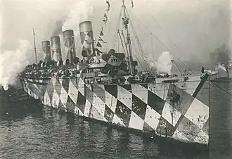 HMT Mauretania with her second geometric dazzle camouflage scheme designed by Norman Wilkinson