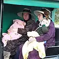 Mennonite women with their children in the same colony