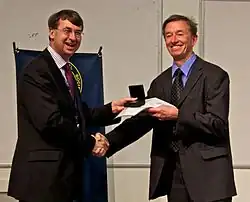 Mike Irwin receiving the Herschel Medal from Roger Davies in 2012