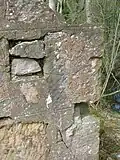 Re-used stones in the gable end wall