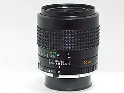 Example of MC-X generation lens: MC Rokkor-HH 35mm f/1.8; note rubberized focusing grip and MC tab (just under the engraved "11" aperture value)