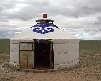 Blue fabric cloud collar motif on a Mongolian yurt.