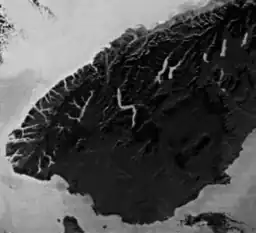 Greyscale satellite image of the South Island, showing the southern lakes