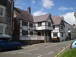 Nantclwyd House in Denbighshire is the oldest-known town house in Wales and an example of Tudor architecture.