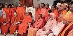 Bodhinatha attends a conference of Natha Sampradaya swamis hosted by Balagangadharanatha Swamiji. Includes Yogi Adityanath on center right.