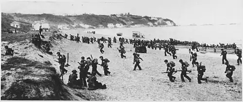 American troops land on an Algerian beach during Operation Torch