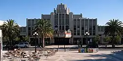 Theatre building in totality with FOX marquee in red across front entrance.