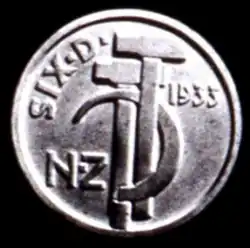 A coin model featuring two hammers with a sickle overlayed between them, alongside the labels SIX D, NZ, and 1933.