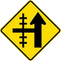 Railway level crossing on side road to left