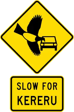 yellow and black traffic sign depicting flying bird