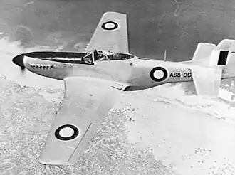 Overhead shot of single-engined fighter aircraft in flight
