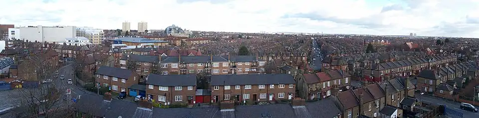 Regular rows of red brick houses stretching into the distance