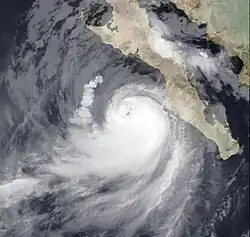 A photograph of a powerful hurricane near the western coast of the Baja California peninsula