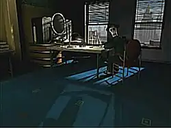 An image of an office rendered by a computer; the office has two windows, a desk, an oval-shaped computer monitor, and additional furniture. The walls and decorations of the furniture have art-deco stylings to them. A skeletal figure sits in one of the chairs looking to the viewer.