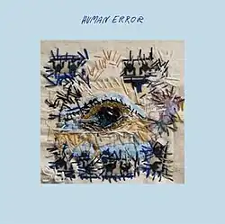 An abstractly-designed patchwork displaying a human eye in the center.