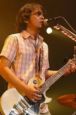 Japanese singer-songwriter Tamio Okuda performing in 2009.