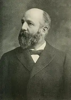 1906 Black and White head and shoulders photo of Oren Elbridge Wilson, facing front, looking to his right