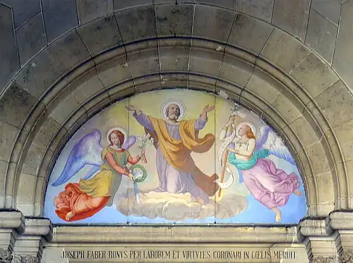 Decoration in the porch over the central portal - "Saint Joseph lifted to heaven by angels"