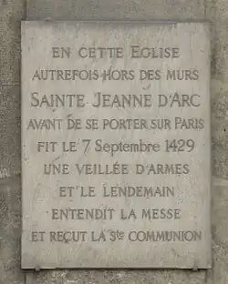 A plaque commemorates the visit of Joan of Arc to the church in 1429