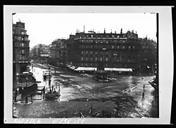 The Great Flood of Paris in January 1910. Looking to the Rue Saint-Lazare from the Square Gabriel Péri. The railway station Paris Saint-Lazare is on the left.