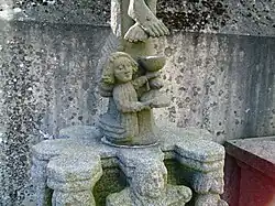 Another view of the "calvaire" type sculpture. Note the angel with chalice collecting blood from Jesus' feet