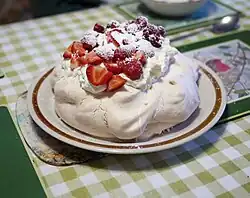Image 2Pavlova, a popular New Zealand dessert, garnished with cream and strawberries (from Culture of New Zealand)