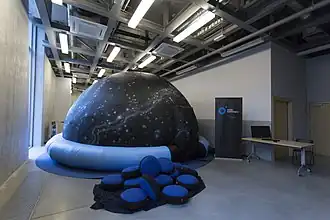 A small inflatable portable planetarium dome.