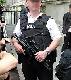 Police officer from Met police London England UK at Downing Street security holding an MP5A3