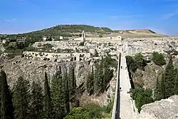 View over the gorge, through which flows the Gravina, towards the eponymous sanctuary to the Madonna to the west
