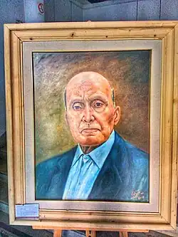 A standing portrait of Mohamed Talbi in a semi-realistic style