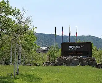 The entrance sign in summer
