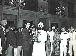 Kapil Dev with then Indian President Zail Singh after the team's return to India post winning the 1983 World Cup. They are holding the Cricket World Cup Trophy