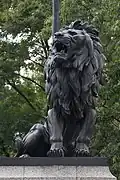 Lion sculpture on the right pedestal.