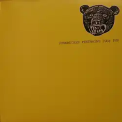 A yellow cover with a bear on the upper-right corner, with "Teddy Bears" in place of its teeth. Underneath the bear reads "Punkrocker Featuring Iggy Pop".