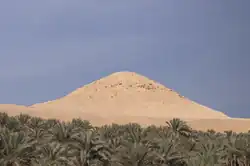 Crumbled remains of a pyramid with the appearance of a mound