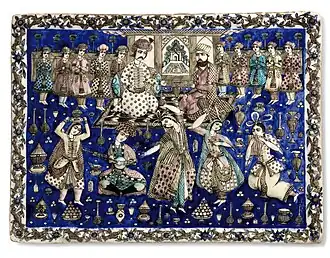 Pottery scene from 19th-century Qajar Iran, showing two seated princely figures, surrounded by courtiers, musicians and dancing girls