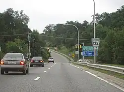 Ground-level view of an at-grade intersection with a traffic signal