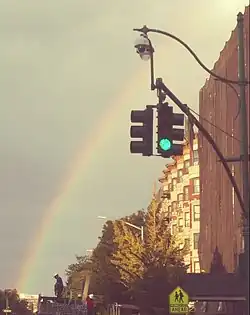 Rainbow over Malcolm X Boulevard, in a view looking northward from Central Park North