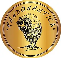 A golden plate with black stripes. In the center is a sketch of an own looking down. Above it is a curved, ancient-like writing of Randonautica.