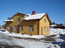 A building with a sign reading "Ransta" over the door.