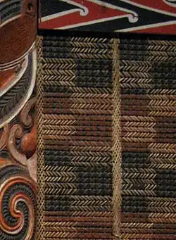 closeup of tukutuku panel in earthy colours with a rectangular pattern