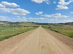 Highway 706 entering Ravenscrag and approaching the bridge across the Frenchman River