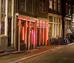 Rooms illuminated by red lights in De Wallen, Amsterdam, Netherlands