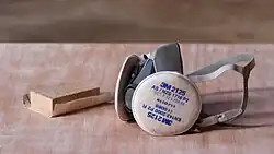 Sanding block with a respirator