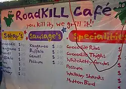 Roadkill Cafe at the Mindil Beach Sunset Markets in Darwin, Australia, carrying the motto "You kill it, we grill it "[85]