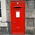 Elizabeth II era Royal Mail wall box in Edinburgh, showing the Crown of Scotland
