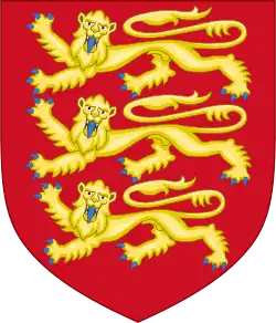 A red shield tapers to its bottom end; on it are three stylised golden lions with blue claws.