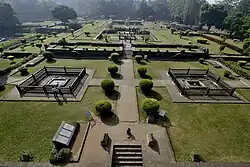The Gardens of Shaniwar Wada are seen. The foundations of many structures as well as fountains are also present.